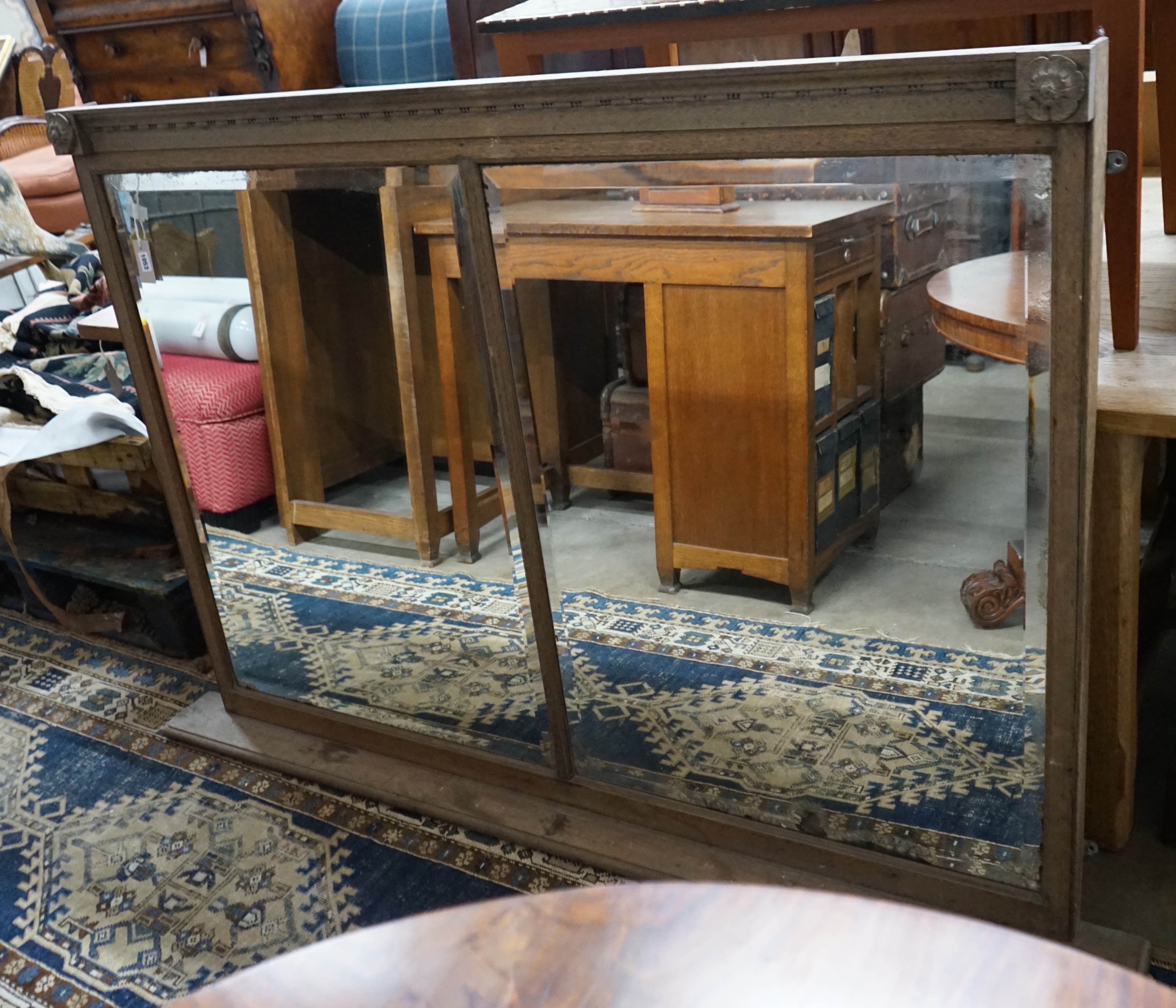 An early 20th century oak framed twin plate overmantel mirror, width 157cm, height 115cm